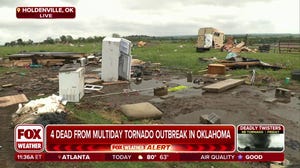 Flooding rains following deadly tornado delay victims' burials