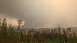 Thousands evacuate Fort Nelson as wildfires spread in western Canada