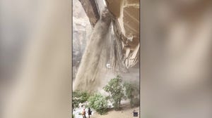 Climber rappels next to 'raging waterfall' that developed during flash flood