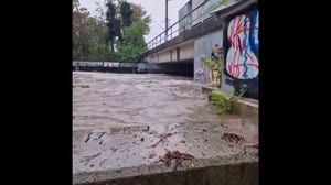 Water sloshes against protective barriers amid flooding in Vienna