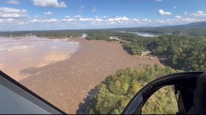 One-mile-long floating barrier installed in East Tennessee lake to catch Helene debris