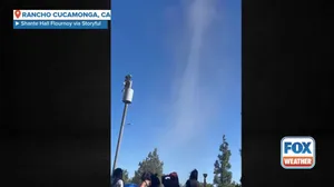 Dust devil sends youth football team ducking for cover