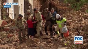 Watch: Elderly couple rescued in devastated town of Letur in eastern Spain following floods