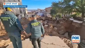 Crews search for flood victims in devastated Spanish town