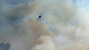 Firefighters prepare to drop water on Montezuma Fire in San Diego