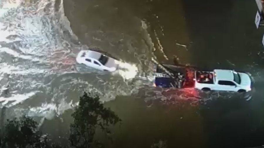 Vehicles destroyed by flooded freeways in Arizona