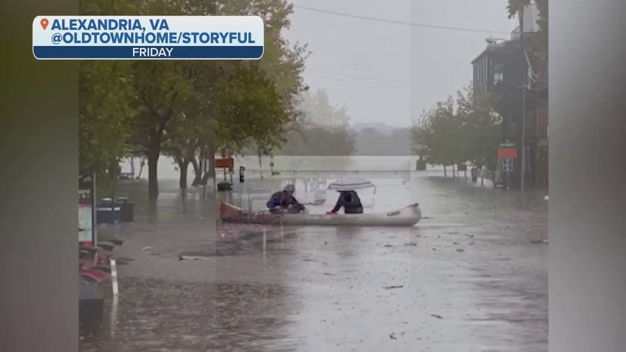 Couple canoes through floodwaters in Alexandria, Virginia