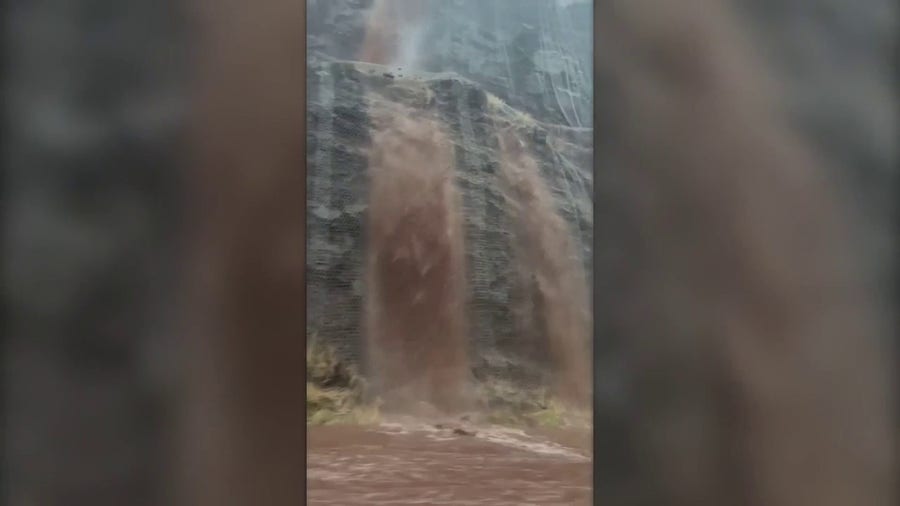 Rainwater cascades onto highway in Maui amid Flash Flood Warnings