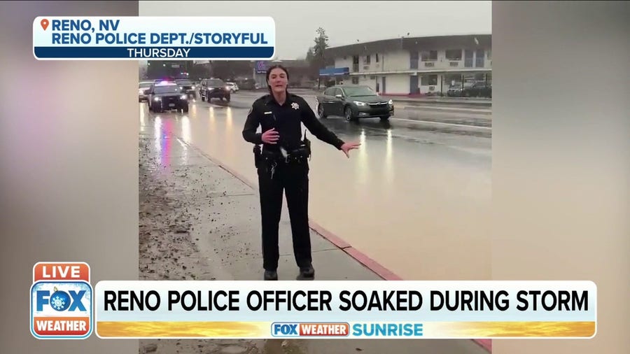 Reno Police Officer soaked during storm