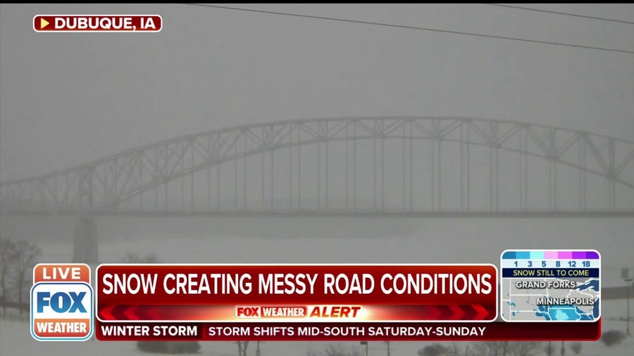 Watch: Iowa bridge hardly visible during winter storm