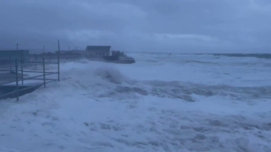 High tide pushes seawater onto Rhode Island beach parking lot
