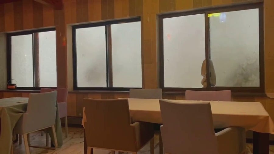 Waves crash against Massachusetts hotel during blockbuster nor'easter