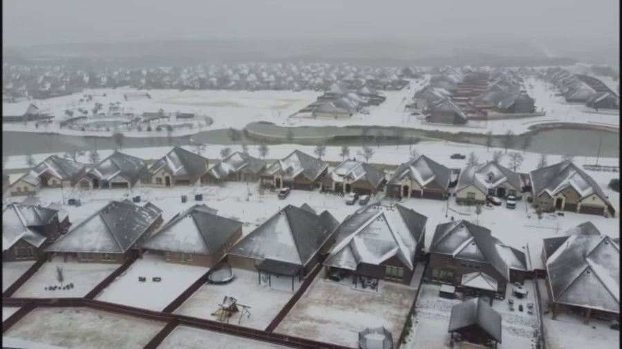 Drone captures snow-capped homes in North Texas