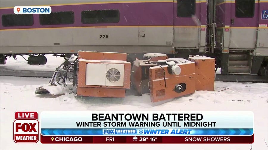 Train hits sidewalk snowplow during winter storm in Boston