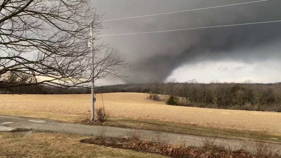Large tornado moves through Winterset, Iowa