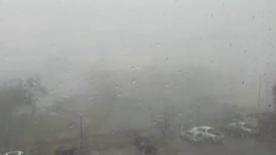 Heavy rain blows sideways in Deland, Florida during storm