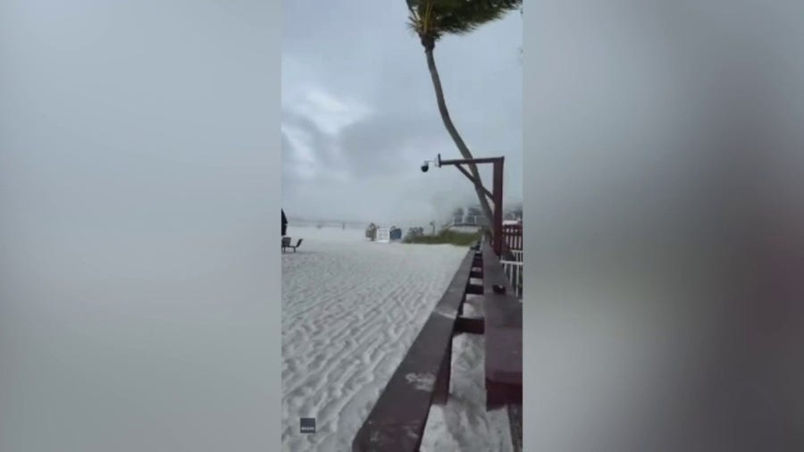 Waterspout Makes landfall On Florida beach, beachgoers scramble