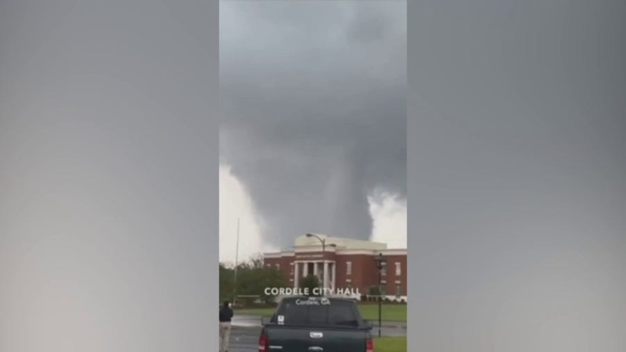 Large funnel cloud appears near courthouse in Cordele, Georgia