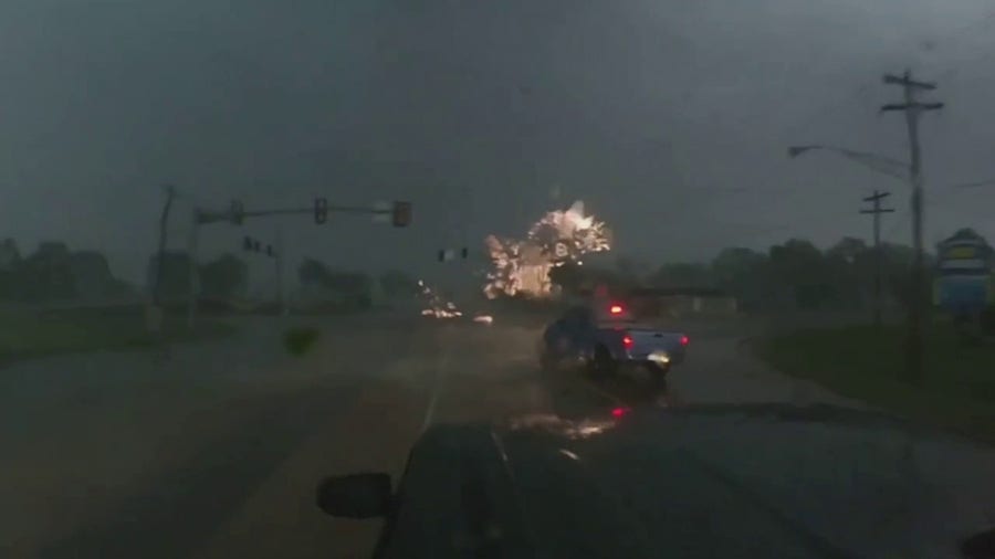 Video shows tornado in progress in Seminole, OK, creating power flashes near storm chaser