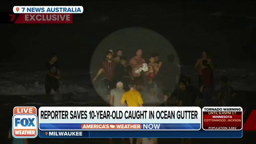Australia reporter rescues drowning boy from rough seas