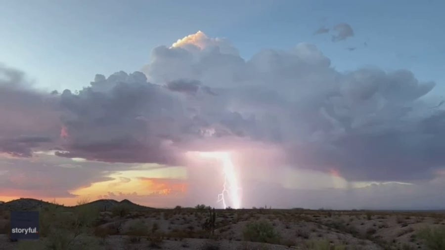 Lightning flashes in Arizona sky amid sunset thunderstorm