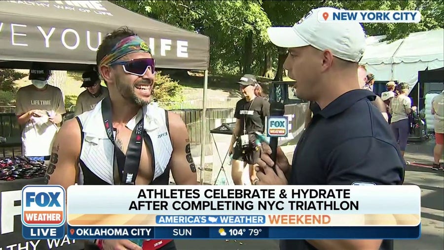 Athletes celebrate and hydrate after completing the NYC Triathlon
