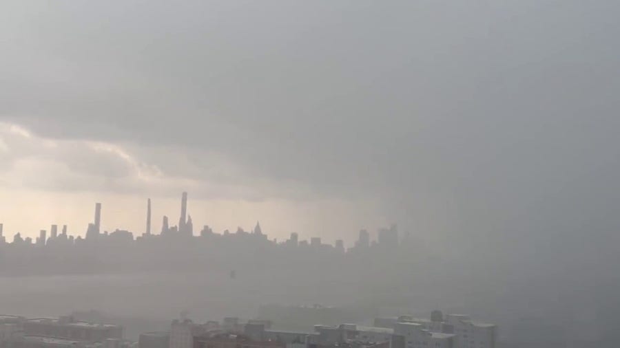 New York City skyline disappears as heavy rain approaches the city