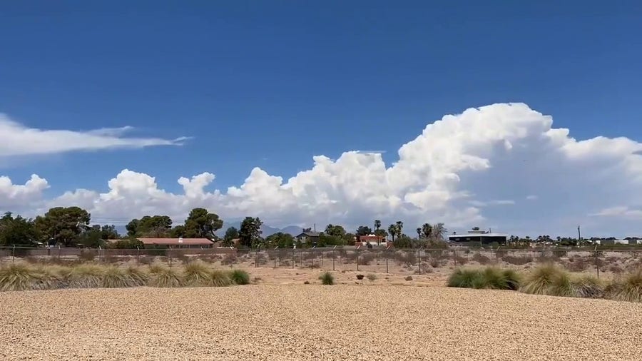 Clouds from flash flood warned storm move through Las Vegas