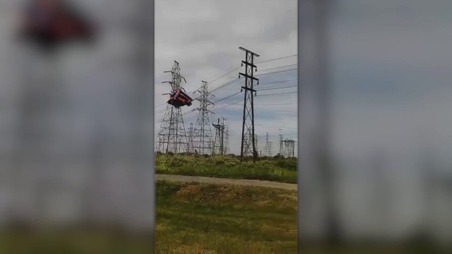 Bounce house sails into power lines