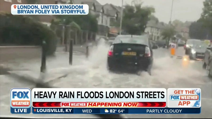 Heavy rain floods the streets of London