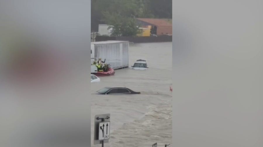 First responders carry out rescues on flooded Texas roadways