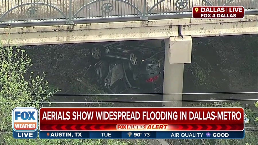 Floodwaters wash away and damage cars in Dallas, TX