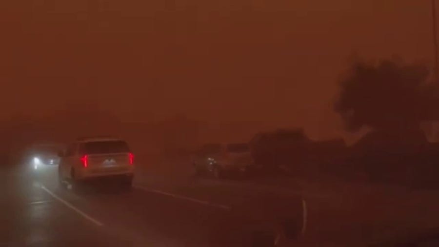 Arizona family takes cover as dust storm darkens sky