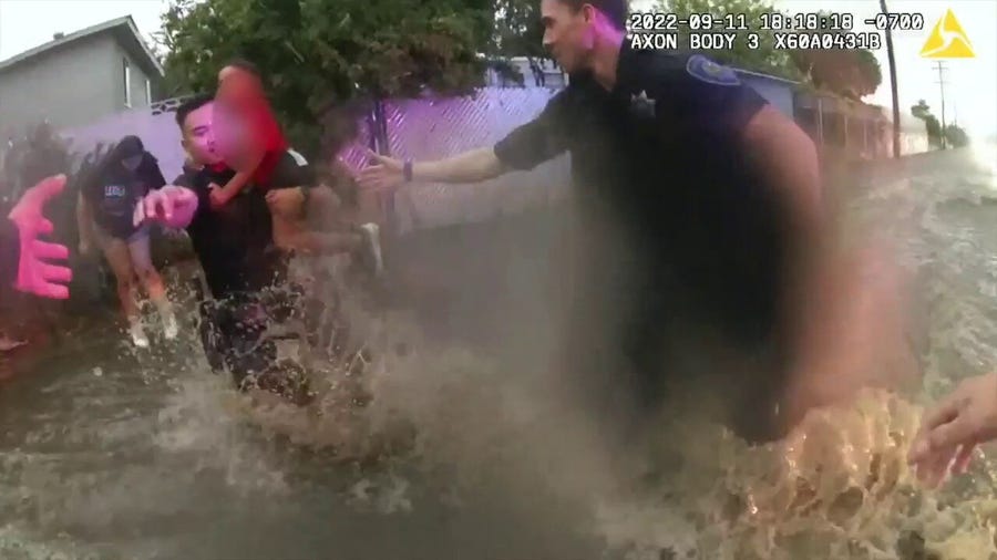 Officers rescue mom, two kids from raging floodwaters in California 