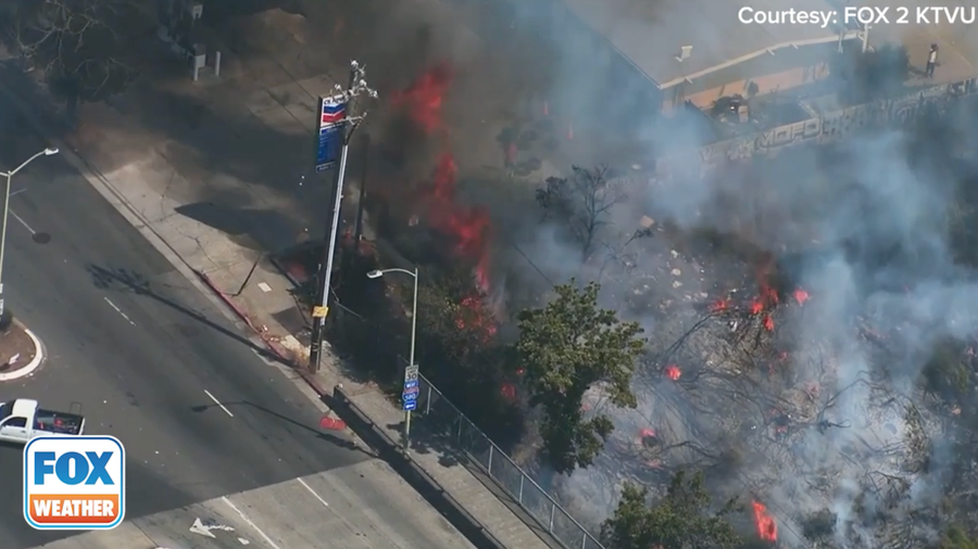 Helicopter footage shows fire burning near Chevron station in Oakland