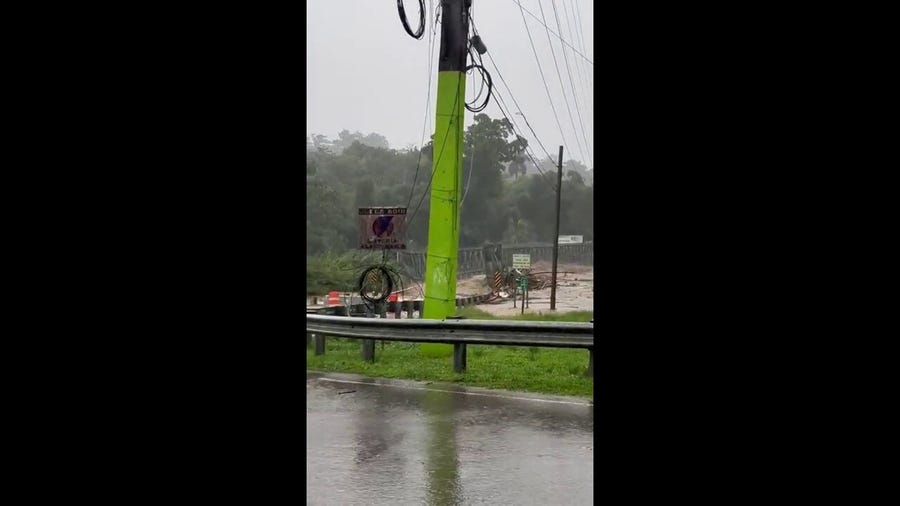 Watch: Fiona floodwaters wash a bridge downstream