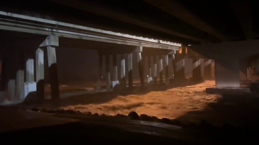 Water from Hurricane Ian rushes under Jolley Bridge in Marco Island