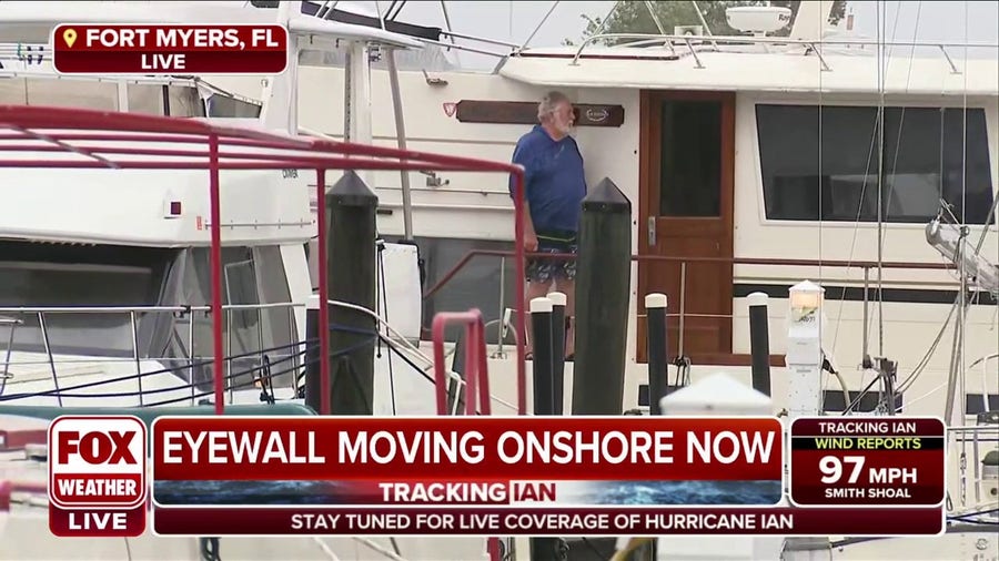 Man seen just standing on boat in Fort Myers as Ian's eyewall begins to move onshore
