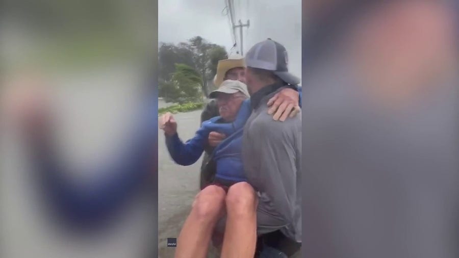 Watch: Good Samaritans rescue elderly man from flooded vehicle during Hurricane Ian