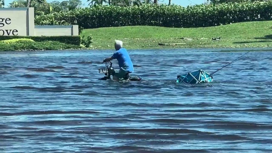 Extensive damage in Fort Myers, man tries to ride bike through flood waters