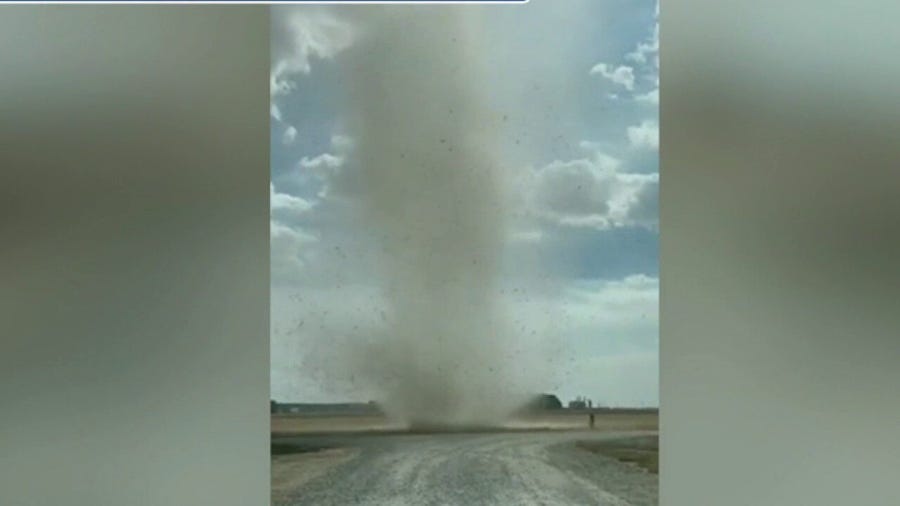 Giant dust devil sweeps across Arkansas farm