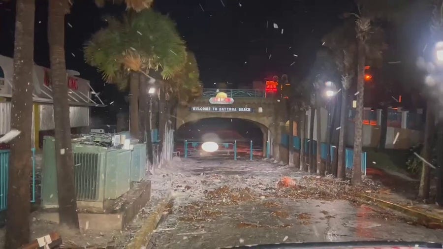 Sea foam from the Atlantic Ocean pushes in on Daytona Beach