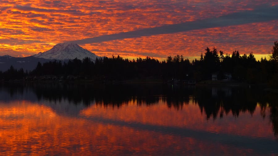 Surreal sunrise gives a spooky shadow off Mt. Rainier