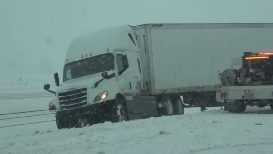Snow piling up on Interstate 94 in North Dakota as blizzard conditions continue