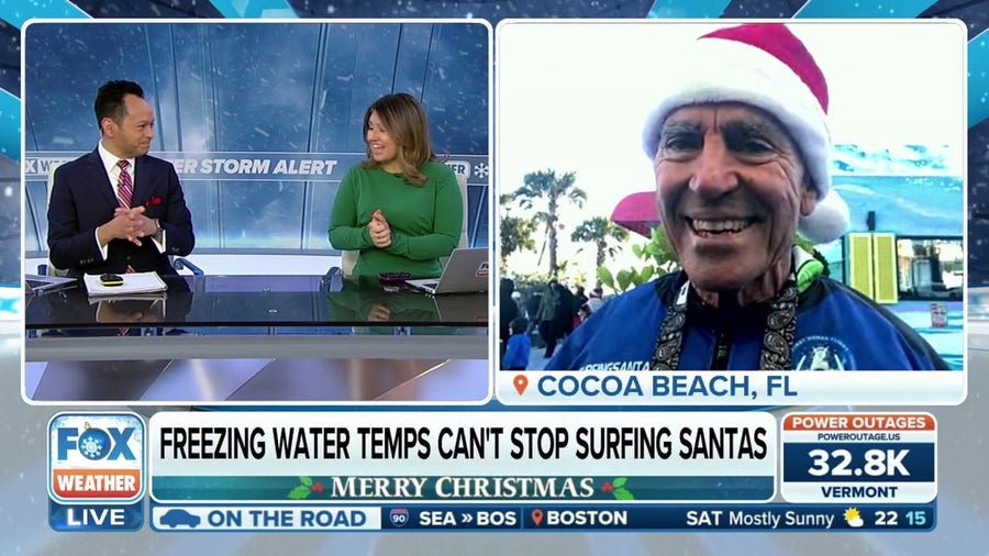Freezing water temps can't stop surfing Santas in Cocoa Beach, Florida