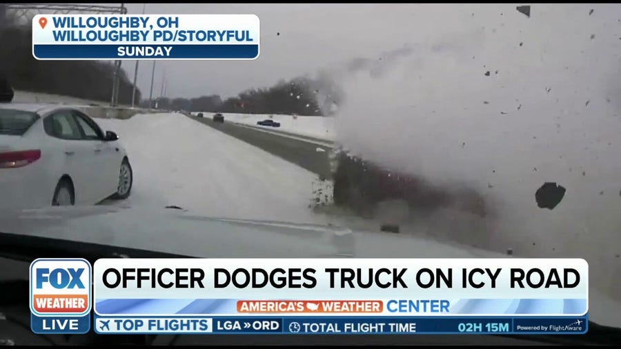 Ohio police officer avoids getting hit by truck on icy road
