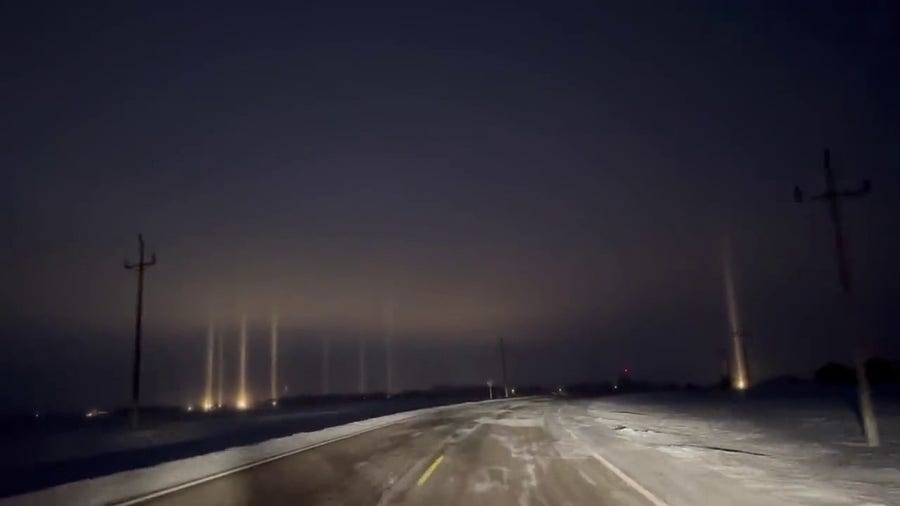 Watch: Light pillars illuminate night sky in Minnesota
