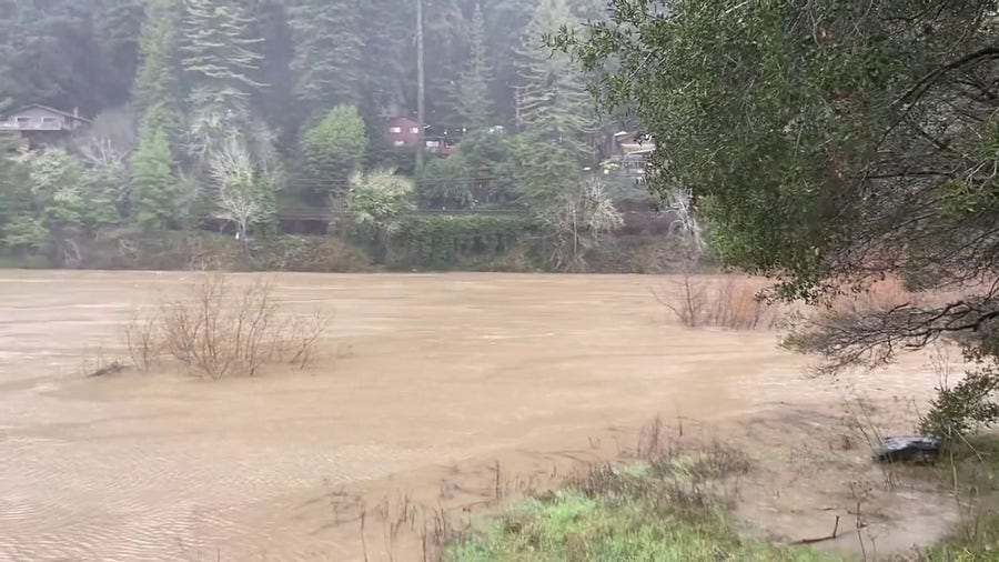 California river surges with floodwater after bomb cyclone