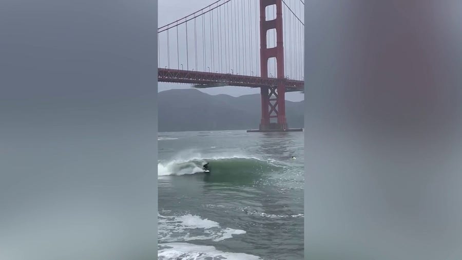 California surfers ride waves during bomb cyclone