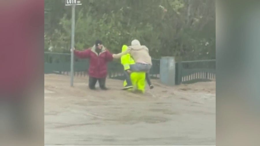 California man rescues, carries individual across flooded streets